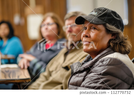 Focused woman working on laptop in cozy cafe at night 112770732