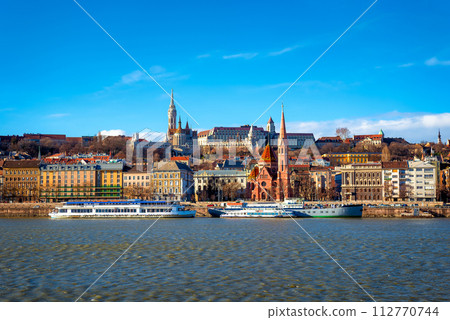 View of the Buda from Pest. The Fisherman's Bastion, the Matthias Church and Protestant church. Budapest, Hungary View of the Buda from Pest. The Fisherman's Bastion, the Matthias Church and Protestant church. Budapest, Hungary 112770744
