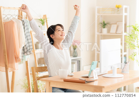A young woman working from the living room during telework 112770854