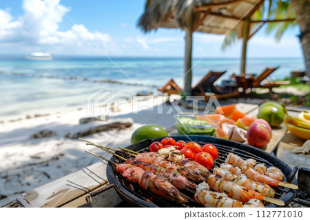 Indulge in a luxurious tropical beachside barbecue feast with grilled seafood, chilled beverages, and a stunning ocean view at a thatched hut by the seaside 112771010