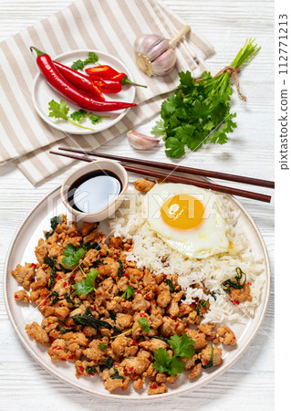 basil chicken stir fry with rice and fried egg 112771213