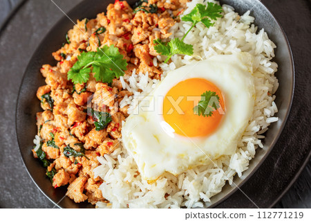 basil chicken stir fry with rice and fried egg 112771219