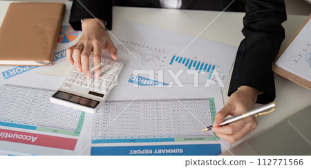Documents, Business woman and accountant reading report for information, financial data or analysis. Paperwork, auditor check, review and bookkeeping, Calculate finance and tax in office 112771566