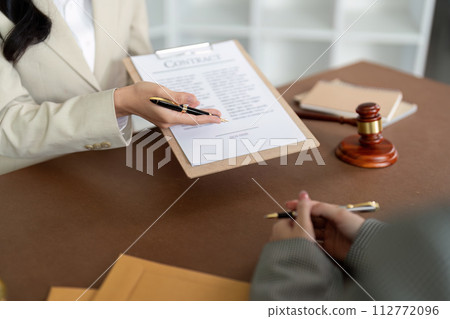 Consultation and conference of lawyer and business people discussion at law firm in office. Concepts of law, Judge gavel with scales of justice 112772096