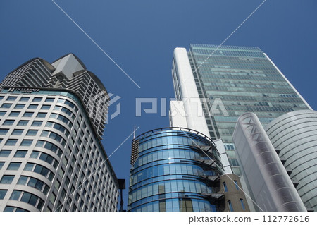 A group of high-rise buildings crowded together A group of high-rise buildings crowded together 112772616