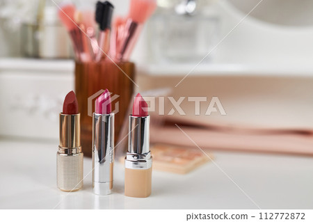 Decorative cosmetics on dressing table Decorative cosmetics on dressing table 112772872