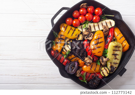 Colorful grilled vegetables on a pan barbecue 112773142