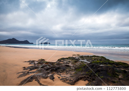 Dramatic coastal landscape with wet dark rocks. Beach of Porto Santo 112773800