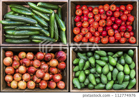 Vegetables harvest in boxes. Agricultural farm vegetables at the market or supermarket. Vegetables harvest in boxes. Agricultural farm vegetables at the market or supermarket. 112774976