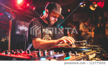 AI-generated content. A DJ wearing headphones is seen in action, mixing music on the turntables at a lively party or club event AI-generated content. A DJ wearing headphones is seen in action, mixing music on the turntables at a lively party or club event 112775850