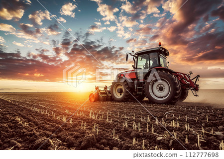 Modern tractor equipment plows an agricultural meadow on a farm in spring and autumn. 112777698