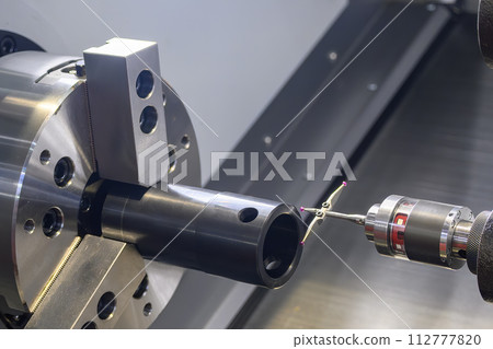 The modular touch probe checking the tube parts on CNC lathe machine. 112777820