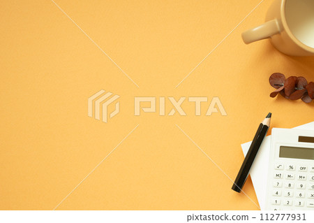 Workspace concept. Notepad, pencil, calculator, mug cup, plant on orange desk background. flat lay, top view, copy space 112777931