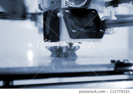 3D printer prints an object. The process of printing model on 3D printer. Model printed on 3D printer from molten plastic. 3D printing technologies. Additive progressive new modern printing technology 112778281