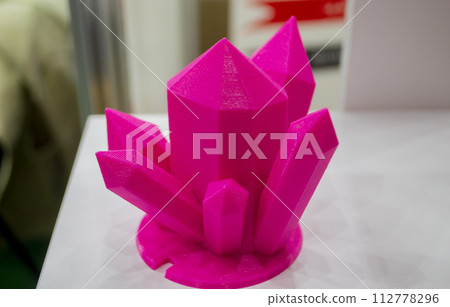 Abstract art object printed on 3D printer. Colored pink creative model printed 3D printer from molten ABS PLA plastic filament. Object printed FDM printer. Additive progressive new modern technology 112778296