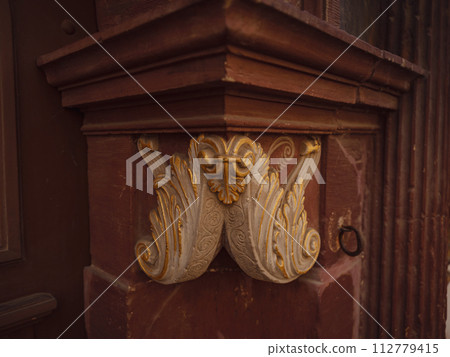 spring trip to Europe. Travel and German sightseeing locations. facade of old historic houses somewhere in Erfurt city, details of ancient medieval houses, decoration of walls and corners of building 112779415