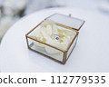 wedding gold rings on a ceremony table 112779535