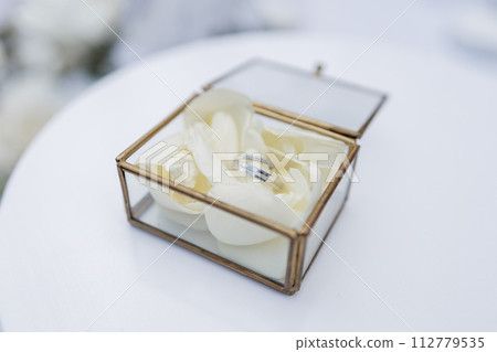 wedding gold rings on a ceremony table wedding gold rings on a ceremony table 112779535
