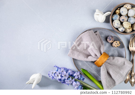Stylish Easter table serving for cafes and restaurants in gray Top view Horizontal format Copy space 112780992