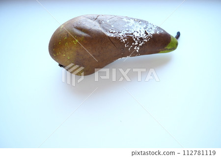 The pear became moldy. A mold or mould. The dust-like, colored appearance of molds is due to the formation of spores containing fungal secondary metabolites. Perishable food products. White background 112781119