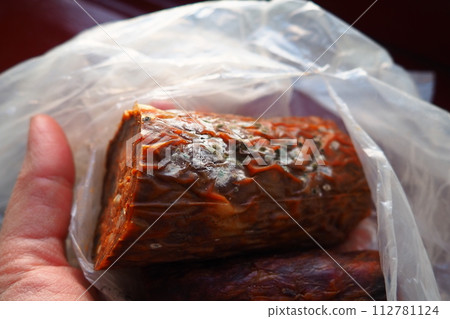 Raw smoked sausage became moldy while it was in a plastic bag. A mold or mould. The dust-like, colored appearance of molds is due to the formation of spores containing fungal secondary metabolites. Raw smoked sausage became moldy while it was in a plastic bag. A mold or mould. The dust-like, colored appearance of molds is due to the formation of spores containing fungal secondary metabolites. 112781124