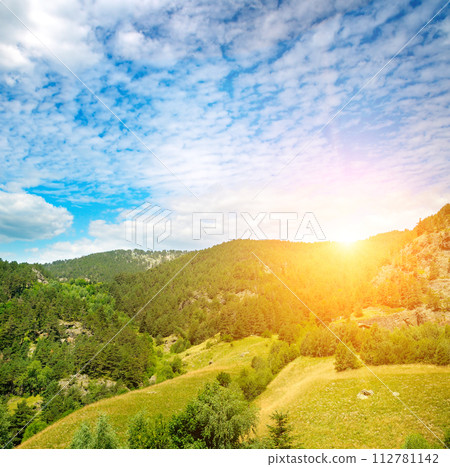 Picturesque mountains, meadow and bright sunrise . Andorra. 112781142