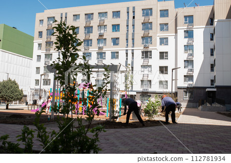 Residential buildings with a playground in the courtyard Residential buildings with a playground in the courtyard 112781934