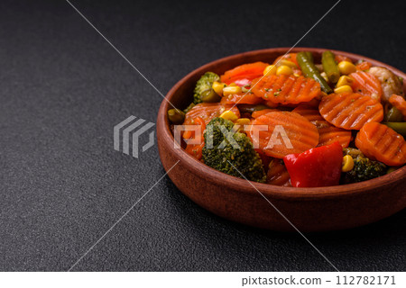 Delicious healthy vegetables steamed carrots, broccoli, asparagus beans and peppers Delicious healthy vegetables steamed carrots, broccoli, asparagus beans and peppers 112782171