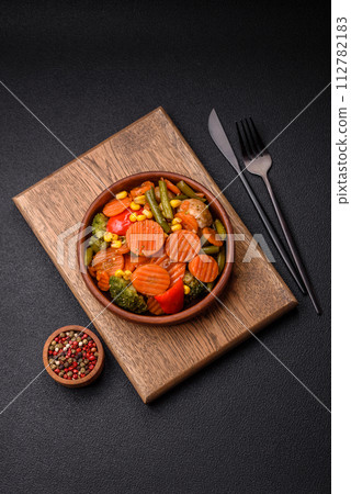 Delicious healthy vegetables steamed carrots, broccoli, asparagus beans and peppers Delicious healthy vegetables steamed carrots, broccoli, asparagus beans and peppers 112782183