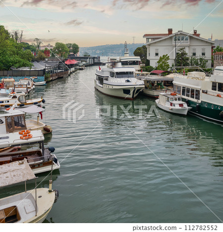 Goksu Stream, with docked boats, beside Anadolu Hisari castle on the Anatolian side of the Bosporus, Istanbul, Turkey 112782552