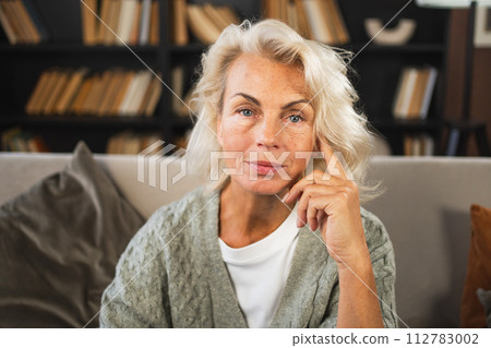 Portrait of confident stylish European middle aged senior woman. Older mature 60s lady smiling at home. Happy attractive senior female looking camera close up face headshot portrait. Happy people 112783002
