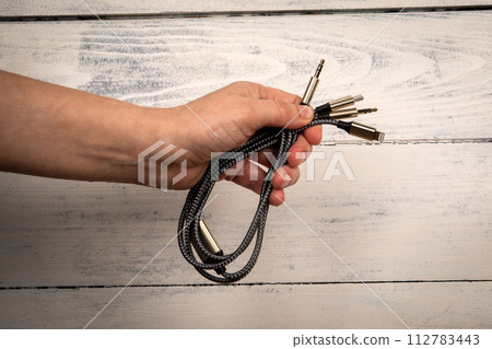 3 In 1 Type-C3.5mm Jack Aux Cable in hand. White background 112783443