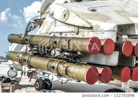 Rocket launcher under wing of military helicopter 112783896