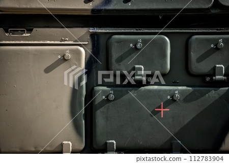 Green metal surface of the military vehicle 112783904