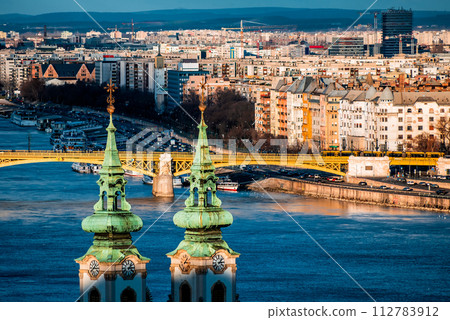 Margaret bridge and St. Anna Church at Danube embankment. Budapest, Hungary 112783912