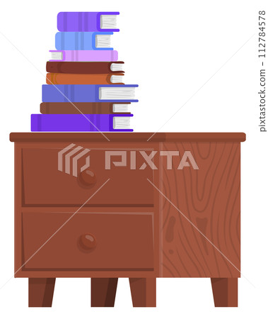 Wooden chest of drawers with book stack. Bedside table reading Wooden chest of drawers with book stack. Bedside table reading 112784578
