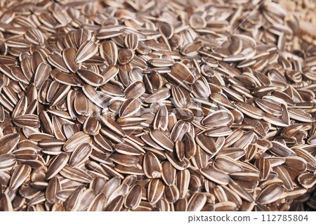 sun flower seeds in a bowl on table  sun flower seeds in a bowl on table  112785804