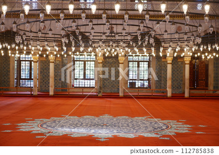 A vacant mosque featuring a circular floor pattern A vacant mosque featuring a circular floor pattern 112785838