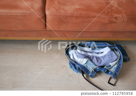 Jeans thrown off on the floor Jeans thrown off on the floor 112785958