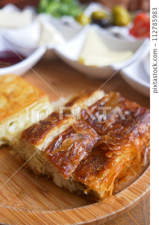 Traditional Turkish Cuisine Pastries borek on a plate Traditional Turkish Cuisine Pastries borek on a plate 112785983