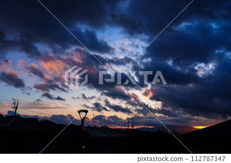Sunset spreading between the clouds in a park after the rain. In a park in Nara city area ③ Sunset spreading between the clouds in a park after the rain. In a park in Nara city area ③ 112787347