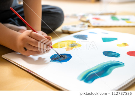 A boy drawing a picture A boy drawing a picture 112787586