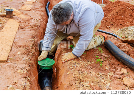 Laying underground drainage pipe system for outflow of rain stormwater Laying underground drainage pipe system for outflow of rain stormwater 112788080