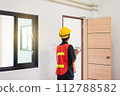 Men home Inspector surveyor wearing vests and hard hat at new property 112788582