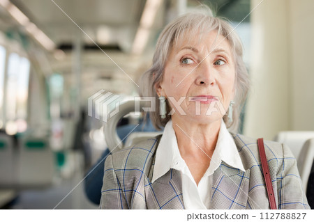 Senior woman in tram 112788827