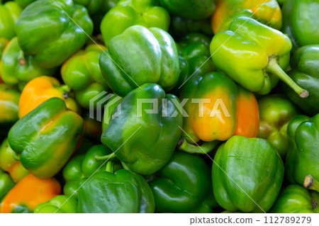 Bell pepper for sale on counter of farmer market. Agricultural products 112789279