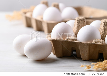 Organic white leghorn egg from free range farm in paper tray 112789364