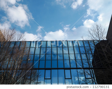 A window reflecting the blue sky A window reflecting the blue sky 112790131