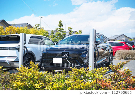 Electric car under charge Electric car under charge 112790695