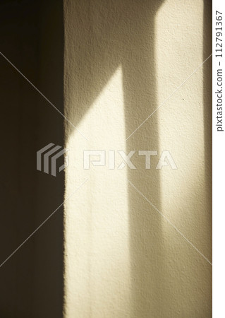 Comfortable rest by the sunny window. A background with sunlight and shadows that can be used in various designs. Comfortable rest by the sunny window. A background with sunlight and shadows that can be used in various designs. 112791367